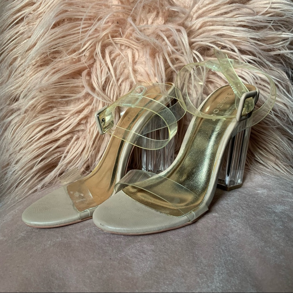 Beautiful clear 4 inch heels. Clear straps and heel with beige and gold bottom.